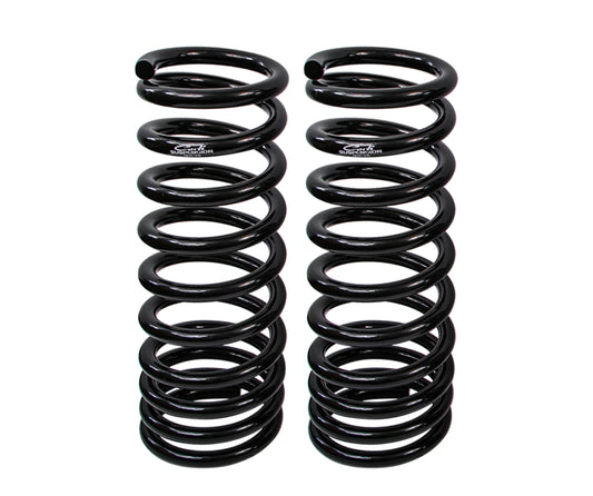 Two Carli Suspension front coil springs for the 03-09 Dodge RAM 2500/3500 (4WD) Diesel model stand upright side by side against a white background. These black, multi-rate coil springs are identical in size and structure, featuring a tightly wound design that delivers a precise and durable 2.75" lift.