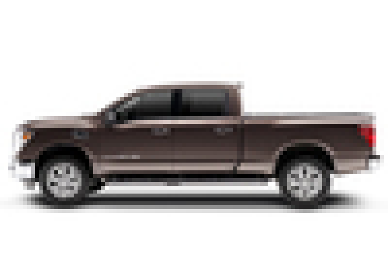 A pixelated side view of a brown pickup truck with four doors and large wheels, featuring a heavy-duty BAK 16-20 Nissan Titan XD 6ft 6in Bed BAKFlip MX4 matte finish aluminum truck bed cover, isolated on a white background.