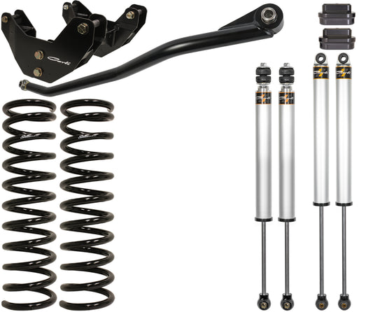 The 13-23 Ram 3500 (4WD - Leaf) DIESEL 3.25" LIFT COMMUTER SYSTEM by Carli Suspension showcases black coil springs, a control arm, dual silver shock absorbers, and additional hardware components set against a white backdrop.