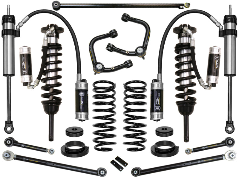 The ICON 03-09 Lexus GX470 0-3.5in Stage 7 Suspension System with Tubular UCA from ICON is a collection of black and silver components, including corrosion-resistant coilovers, springs, upper control arms with Delta Joint technology, shock absorbers, and mounting hardware. These parts are beautifully showcased against a pristine white background.