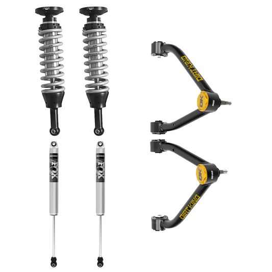 The 07-18 GM 1500 Dirt King Stage 1 Mid Travel Kit with Fox Shocks from LTW Motorsports includes an automotive suspension system featuring two Fox coilover shocks, two standard shocks, and Dirt King control arms. The coilovers and standard shocks prominently display visible springs, while the control arms are highlighted by yellow accents and a "Dynatrac" branding.