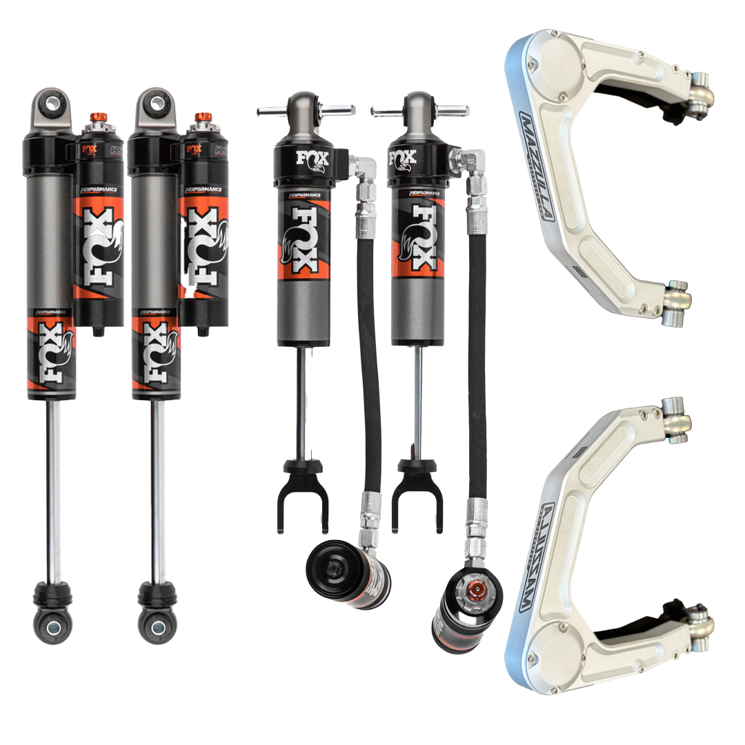 The image shows a 20-24 GM 2500/3500 Mazzulla Stage 3 Mid Travel Kit by LTW Motorsports, featuring four FOX performance shock absorbers, each with attached reservoirs and hoses, along with two pairs of Marzocchi motorcycle suspension forks.