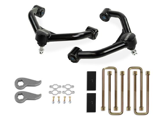 Image showcasing the Cognito 3-Inch Standard Leveling Lift Kit for 20-24 Silverado/Sierra 2500/3500 (2WD/4WD) by Cognito Motorsports, featuring two black control arms. The kit includes adjustable torsion keys, two blocks, U-bolts, and various bolts and washers, all neatly arranged on a white background.