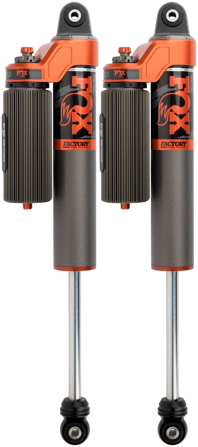 The FOX 21-23 F-150 Factory Race Series 3.0 Internal Bypass Piggyback shocks come as a pair and feature external reservoirs and dual-rate springs with orange accents. These high-performance shocks are designed specifically for off-road vehicles like the Ford F-150, offering adjustable damping, Dual Speed Compression adjustment, and enhanced suspension performance.