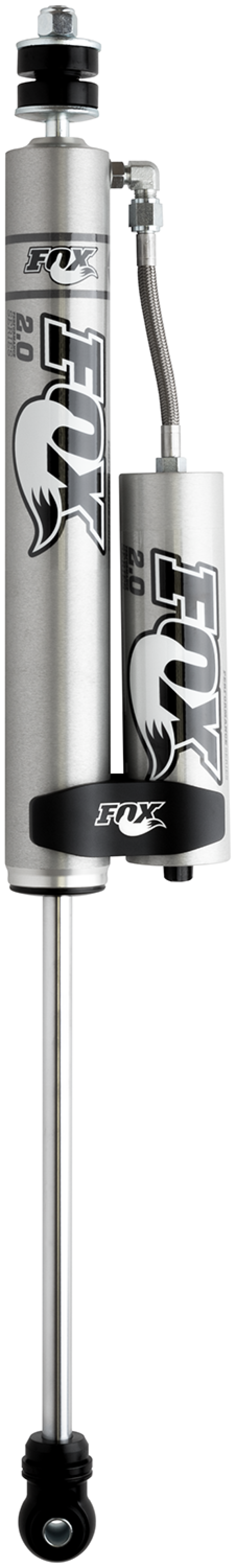 Close-up of the Fox 14+ Dodge 2500 2.0 Performance Series Front Shock featuring a smooth body design and a cylindrical reservoir, clearly displaying FOX branding. Engineered for off-road performance, it includes advanced shock valving and a coil-like spring design, along with a polished, smooth rod at the base, suitable for lifting between 2-3.5 inches.