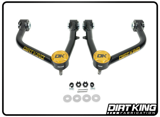 An image of the 07-21 Toyota Tundra Ball Joint Upper Control Arms by DIRT KING, featuring advanced suspension geometry with two black and gold components designated "Driver" and "Passenger." Below, several hardware pieces are displayed, including robust Moog ball joints. The DIRT KING logo is prominently placed in the bottom right corner.