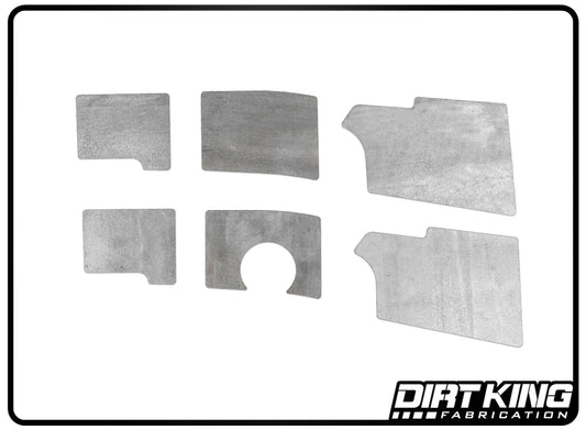 The "19-24 GM 1500 Front Frame Plate Kit" from DIRT KING includes six gray metal plates in various geometric shapes arranged within a rectangular frame. Designed specifically for off-road vehicles, this kit is perfect for enhancing GM 1500 frame rails and features the "DIRT KING" logo in the bottom right corner.