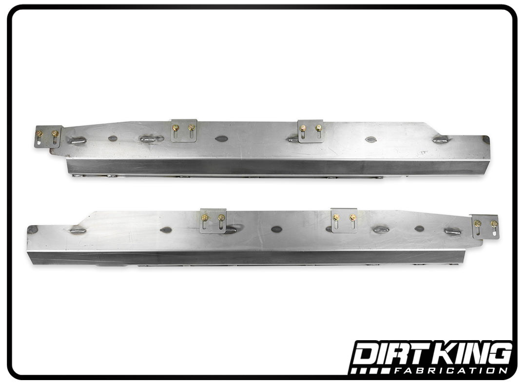 Against a white backdrop, two horizontally aligned 99-06 GM 1500 Boxed Core Supports with adjustable mounts and holes are showcased. Perfect for long-travel suspension setups, "DIRT KING" is prominently displayed in the bottom right corner, highlighting their precision engineering.