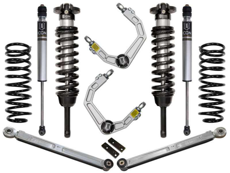 The ICON 03-09 Toyota 4Runner/FJ 0-3.5in Stage 3 Suspension System with Billet UCA by ICON includes coil springs, shock absorbers, and Delta Joint upper control arms, all symmetrically positioned against a white background to enhance corrosion resistance.