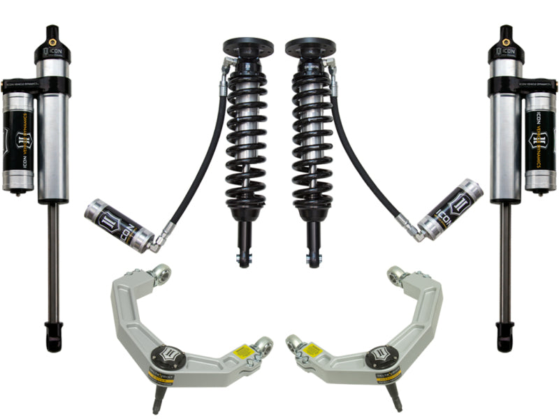 The image showcases the ICON 09-13 Ford F-150 4WD 1.75-2.63in Stage 4 Suspension System with Billet UCA from ICON, featuring a symmetrical arrangement of two corrosion-resistant coil-over shock absorbers, two remote reservoir shocks, and Delta Joint upper control arms against a white background.