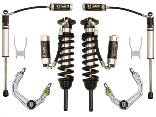 Image of the ICON 05-11 Toyota Hilux 0-3in Stage 5 Suspension System featuring two coilover shocks with springs, two shock absorbers, and two control arms. These off-road vehicle parts are arranged symmetrically and prominently showcase the "ICON" brand logo.