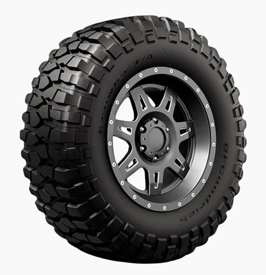 The durable BFGoodrich Krawler TA KX 39x13.50R17 tire, known for its deep and aggressive tread pattern, prominently showcases the BFGoodrich brand and specifications on its sidewall. It is complemented by a stylish black, multi-spoke alloy wheel at its core.