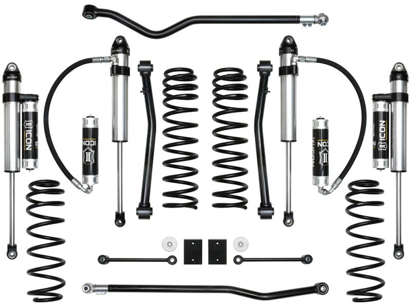 A meticulously arranged set of ICON 2018+ Jeep Wrangler JL 2.5in Stage 5 Suspension System components showcased symmetrically on a white background. The set includes coil springs, shock absorbers, and link bars engineered for optimal ride quality. These components primarily feature black and silver finishes with the ICON brand visible on select parts.