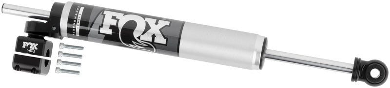 The FOX 2017+ Ford Superduty 2.0 Perf Series 8.1in. TS Stabilizer Steering Damper, featuring a silver and black finish, includes four bolts and a mounting bracket made from high-quality materials. This steering damper is specifically designed for vehicles to improve steering control, minimize vibrations, and enhance off-road performance with its 1-1/8 inch tie rod compatibility.