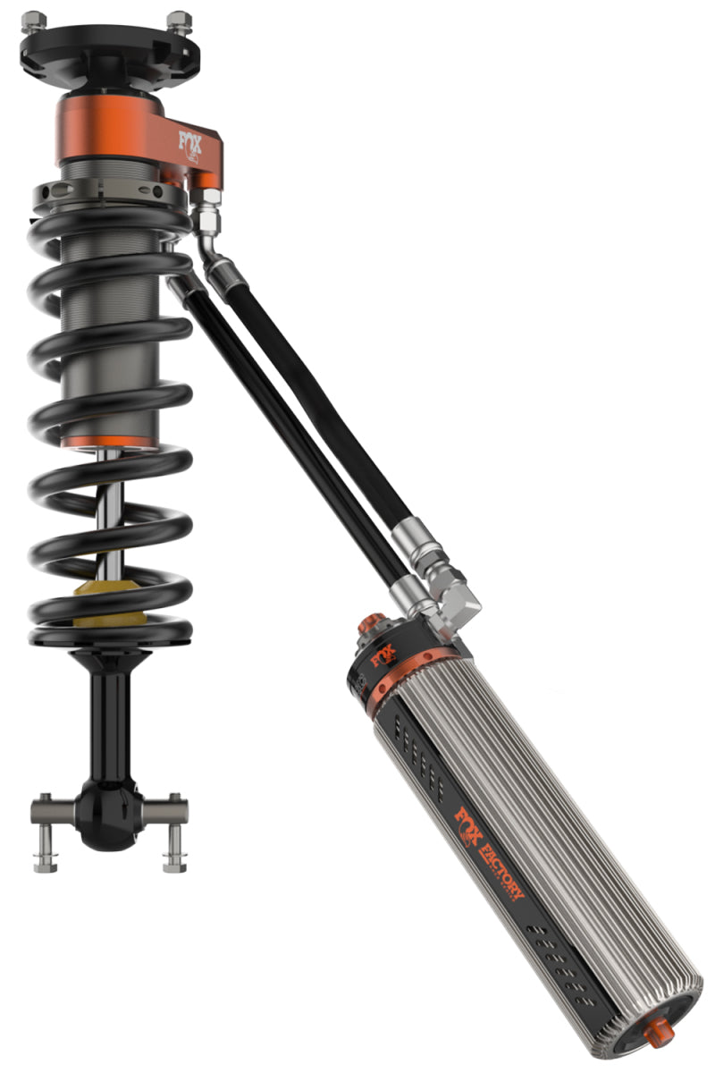 Close-up of a FOX 2019+ Chevrolet Silverado 1500 Factory Race Series 3.0 Internal Bypass Coilovers Front 3.5 Lift, showcasing the shock absorber with attached reservoir, complete with a coil spring and hydraulic hoses. The aluminum bodies feature orange accents to emphasize the internal bypass technology in this automotive suspension component.