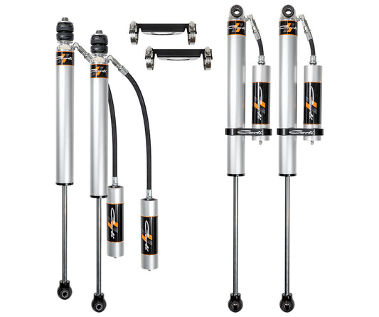 The Carli Suspension 05-23 Ford F-250/F-350 (4WD) Backcountry 2.0 Remote Res 4.5/5.5" Lift Shock Set is on display, ideally designed for the Ford F250/F350. Two sets are arranged vertically, showcasing their sleek silver and black design with connecting hoses, mounting brackets, and logos.