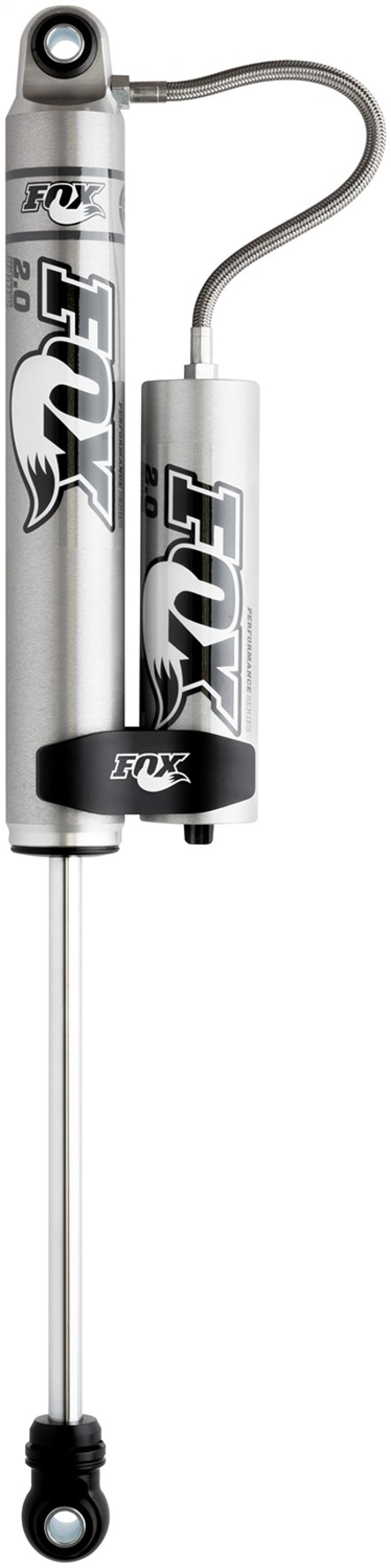 The FOX 99+ Chevy HD 2.0 Performance Series Smooth Body Remote Reservoir Rear Shock, designed for a 4-6 inch lift, features a high-quality craftsmanship with a sleek cylindrical body. It displays the FOX branding and logo, complemented by black and gray components. The design includes an attached reservoir and a flexible hose extending from the top, making it ideal for off-road adventures against a white background.