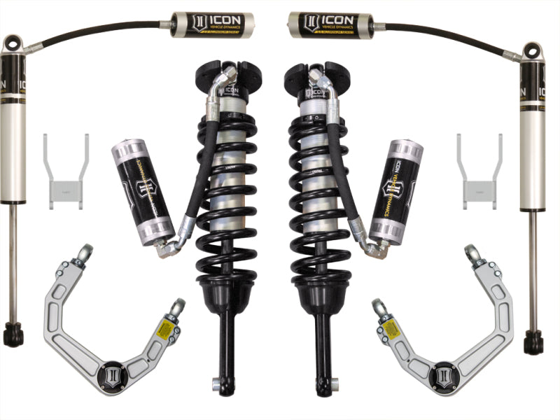 The ICON 05-11 Toyota Hilux 0-3in Stage 4 Suspension System w/Billet UCA by ICON, ideal for off-road adventures, includes performance coilover shocks, remote reservoirs, control arms, and mounting brackets displayed on a white background. The components are neatly arranged side by side to highlight their design and structure.