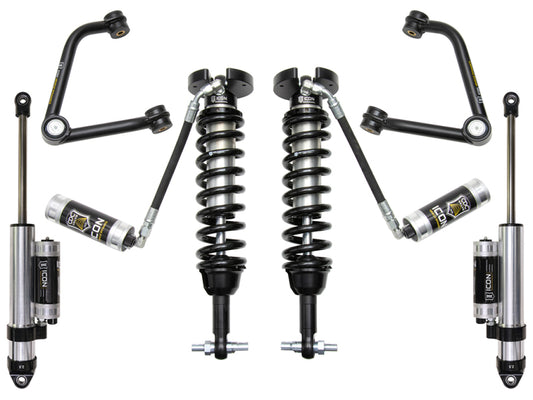 Image showcasing the ICON 2019+ GM 1500 1.5-3.5in Stage 4 Suspension System w/Tubular Uca, featuring an array of automotive shock absorbers and coil springs, as well as iconic tubular steel upper control arms equipped with the Delta Joint. The components are positioned symmetrically against a white background, emphasizing their advanced design and structure.