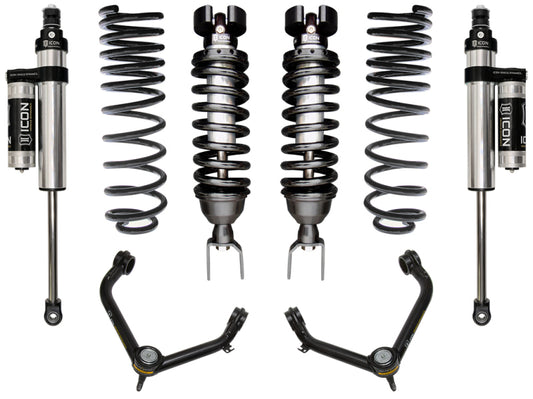 Image of the ICON 2019+ Ram 1500 2/4WD .75-2.5in Stage 4 Suspension System w/Tubular UCA, displaying two coilover shocks with springs, two additional shocks, and upper control arms with the "ICON" brand logo on the shock absorbers. These corrosion-resistant parts are symmetrically arranged on a white background.