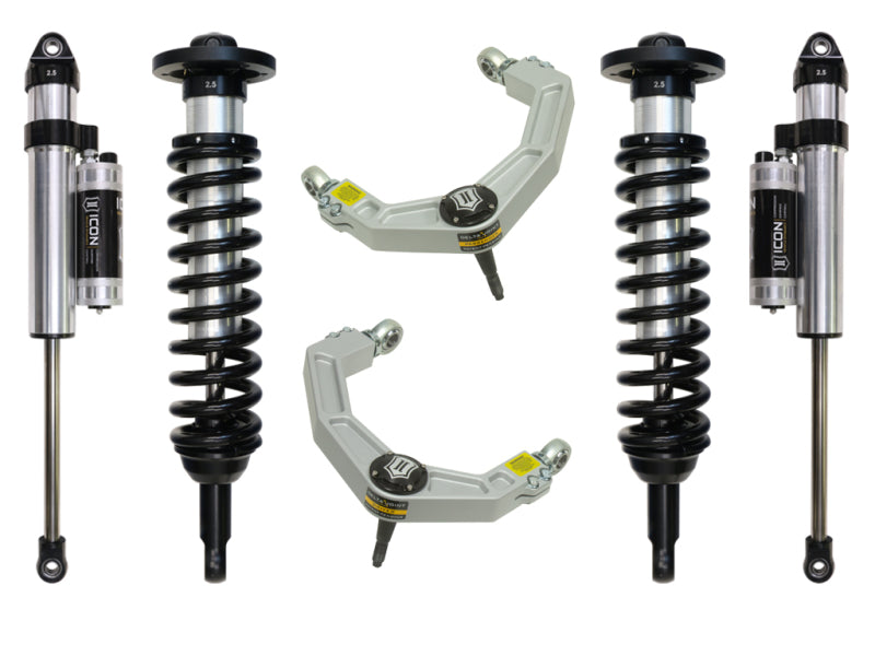 Image of the ICON 04-08 Ford F-150 4WD 0-2.63in Stage 4 Suspension System w/Billet Uca by ICON, featuring four shock absorbers with black coils and silver bodies, complete with external reservoirs. The set also includes two silver upper control arms with corrosion-resistant construction and durable Delta Joints.