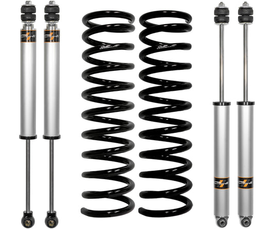 The Carli Suspension 14-23 Ram 2500 (4WD - Coil/Coil) Diesel 2.5" Lift Leveling System includes two silver shock absorbers with black rubber ends and two black coil springs, all arranged vertically against a white background to achieve a precise 2.5" lift.