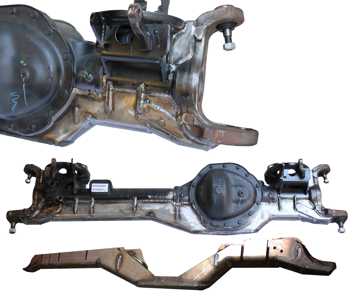 A close-up view of metal car parts from Carli Suspension showcases the 03-12 Dodge RAM 2500/3500 (4WD) Fabricated Axle Truss, along with a differential housing and crossmember. These parts have an industrial appearance, featuring visible welds and metallic surfaces. They are arranged at various angles against a plain, white background.