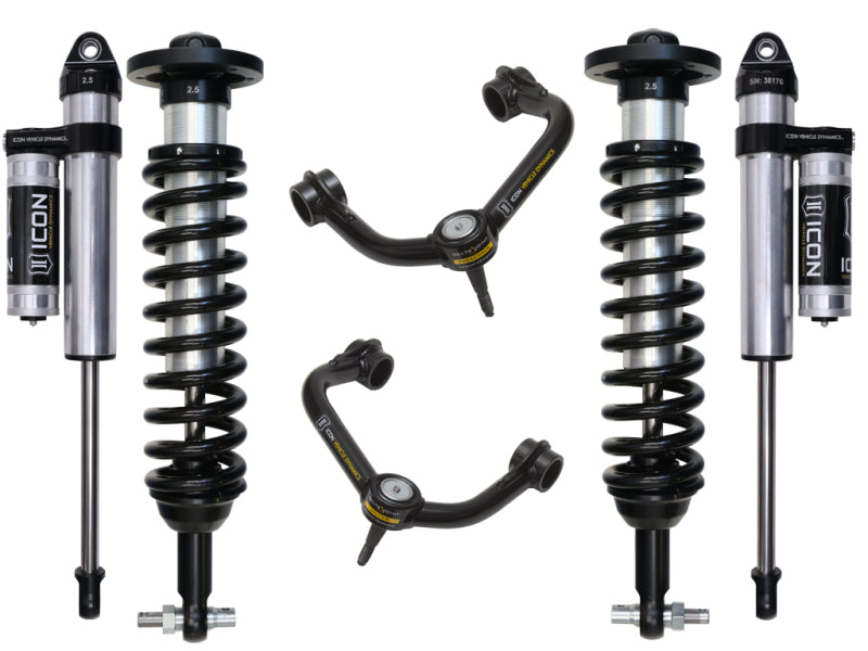 A set of ICON suspension components, specifically the 2015+ Ford F-150 4WD 0-2.63in Stage 3 Suspension System with Tubular UCA, includes two coilover shocks with springs and reservoirs, and two upper control arms featuring Delta Joint technology for enhanced durability. The components are elegantly displayed on a white background.