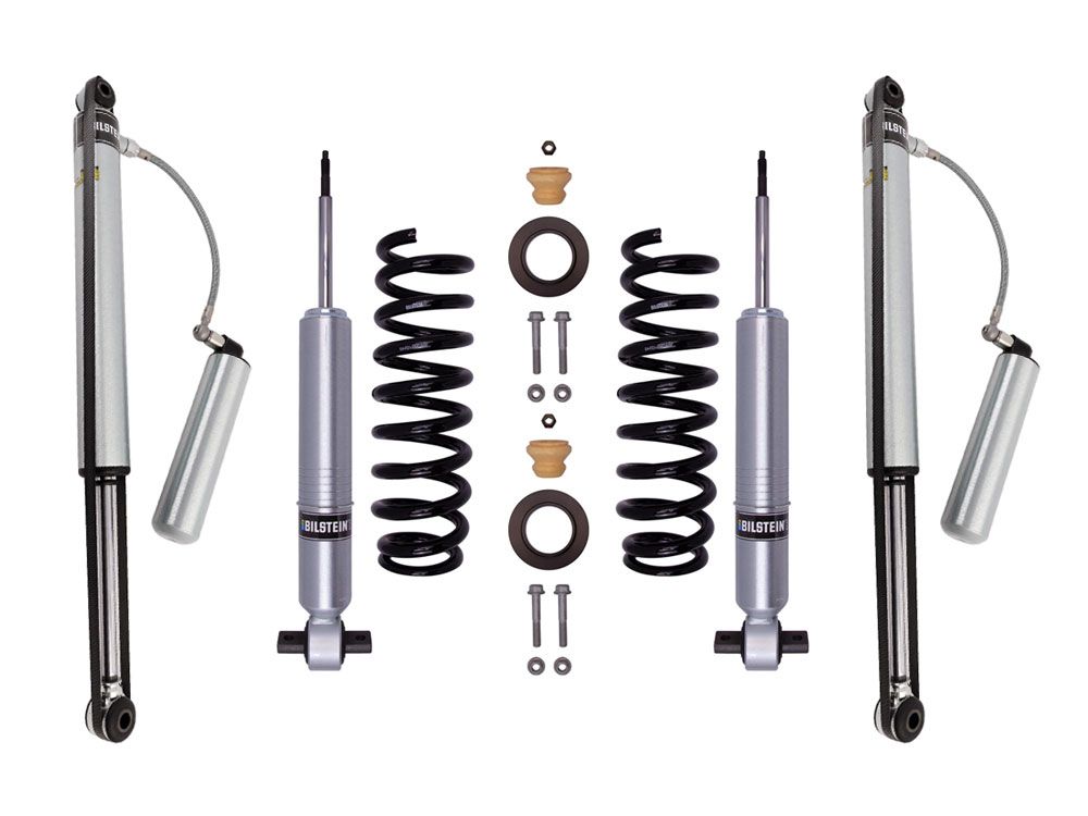 The LTW Motorsports 15-20 Ford F-150 4WD Leveling Kit with Bilstein 6112 Struts and 5160 Shocks features automotive shock absorbers and coil springs for off-road performance. The set includes two silver and black shock absorbers with attached reservoirs, extended length struts, coil springs, and various mounting hardware for symmetric installation.