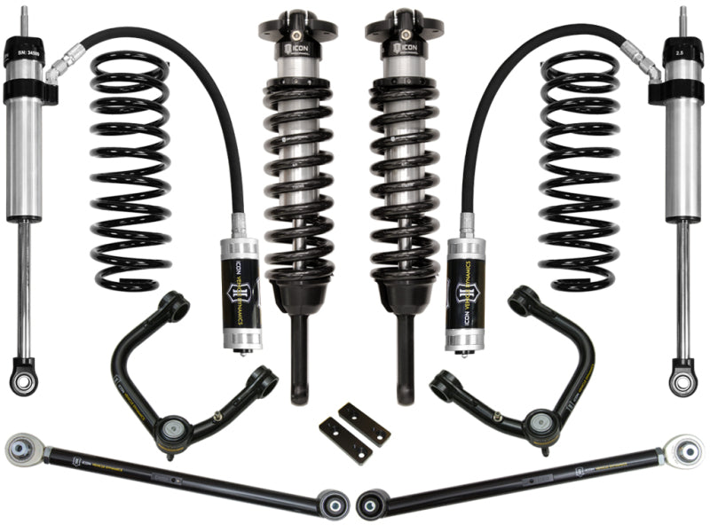 A comprehensive suspension kit named the ICON 2010+ Toyota FJ/4Runner 0-3.5in Stage 4 Suspension System w/Tubular UCA is displayed on a white background. The kit includes shocks, coil springs, Delta Joint upper control arms, and other components, predominantly in black and silver with ICON branding visible on the shocks.