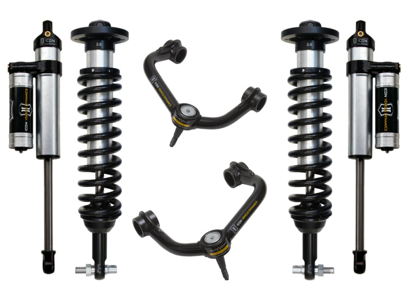 The image showcases the ICON 2014 Ford F-150 4WD 0-2.63in Stage 3 Suspension System with Tubular Upper Control Arms, featuring a symmetrical arrangement of six components. Included are four coilover shocks equipped with external reservoirs and two adjustable upper control arms that integrate Delta Joint technology for superior corrosion resistance, all presented in elegant black and metallic finishes.