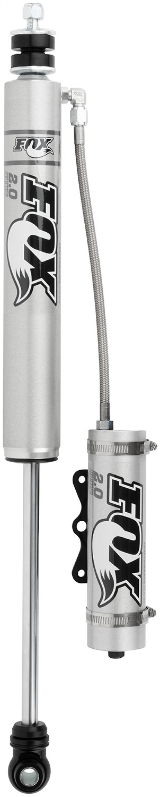 The FOX 05+ Ford SD 2.0 Performance Series Smooth Body Remote Reservoir Front Shock, designed for vehicles with a 4-5-inch lift, features an aluminum body that excels in off-road conditions. This high-performance shock absorber includes a cylindrical reservoir connected via a flexible hose, boasts advanced shock valving technology, and comes complete with all essential mounting hardware.