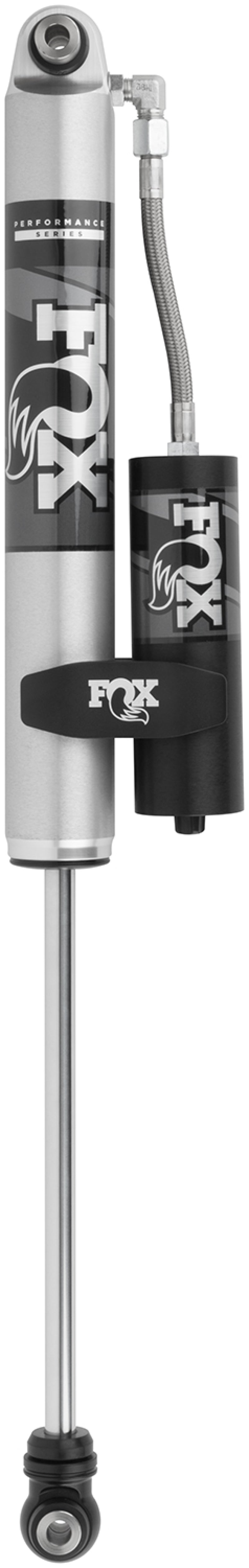 The Fox 2014+ Ram 3500 2.0 Performance Series Smooth Body Remote Reservoir Rear Shock for a 2-3.5 inch lift is a silver and black automotive component featuring a clearly labeled reservoir with the "FOX" branding and an adaptable hose attachment. Its sleek metallic design highlights its off-road capabilities and fade-resistant performance, reflecting sophisticated, performance-focused shock valving.