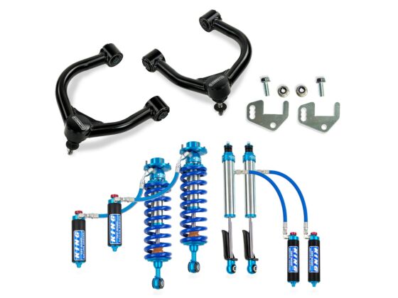 The Cognito Motorsports 3-Inch Elite Leveling Lift Kit for the 2022-2024 Toyota Tundra 2WD/4WD with Rear Air Ride includes sleek black control arms and King 2.5 Reservoir Shocks featuring silver shocks, blue coils, and blue hoses. It also provides a front lift for enhanced performance and comes with additional mounting hardware.