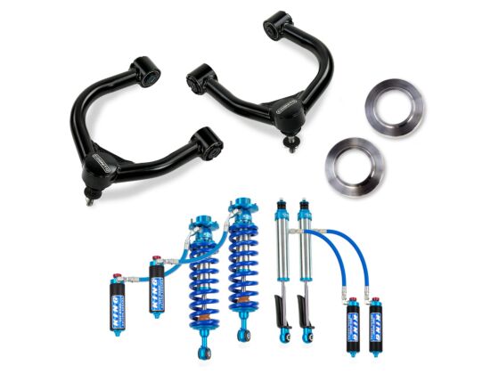 A set of black control arms, metal rings, and blue adjustable King 2.5 Reservoir Shocks from the Cognito 3-Inch Elite Leveling Lift Kit for the 22-24 Toyota Tundra 2WD/4WD with Rear Coil Springs, arranged on a white background.