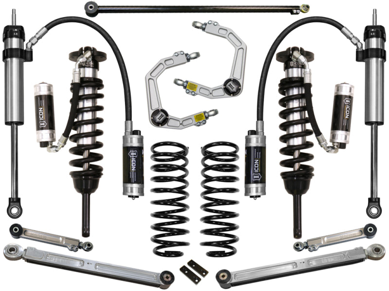 A set of suspension components for the ICON 03-09 Toyota 4Runner/FJ 0-3.5in Stage 7 Suspension System is displayed symmetrically on a white background. Featuring billet upper control arms, coil springs, and shock absorbers with a metallic finish and "ICON" branding, these parts offer corrosion resistance for lasting durability.