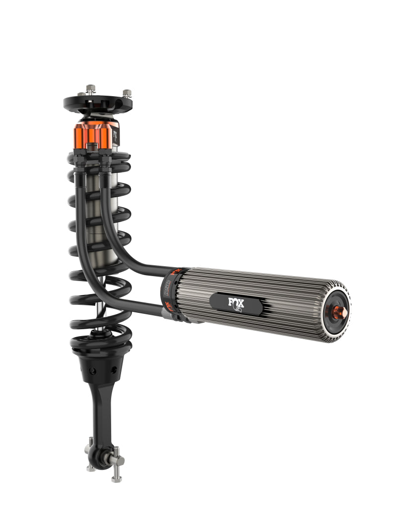 The image features a high-performance FOX 2021+ Ford F-150 2.5in Lift with UCA Front Factory Race Series 3.0 Internal Bypass Coilovers - Adj. Ideal for off-road adventures, this model includes a coil spring and black components, highlighted by an orange adjustment dial to enhance control with its advanced Internal Bypass shocks.