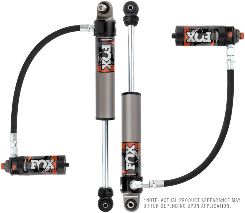 A pair of Fox 2017+ Ford SD 2.5 Performance Elite Series Reservoir Front Shocks with DSC Adjustment for a 0-1.5 inch lift, featuring attached reservoirs and hoses. The metallic components proudly display the signature FOX logo in orange and white. Please note that the actual appearance of the product may vary depending on the application to enhance wheel travel.