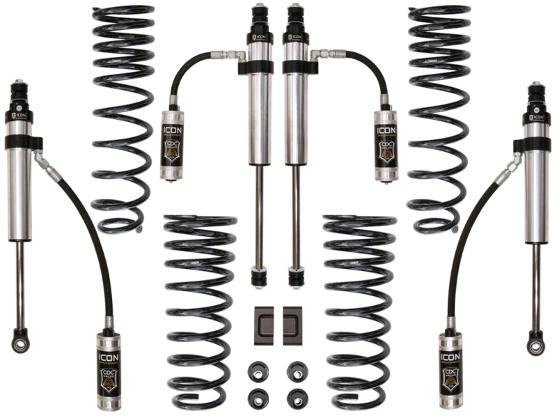 Enhance your vehicle's off-road potential with the ICON 91-97 Toyota Land Cruiser 80 Series 3in Stage 3 Suspension System by ICON, which includes four coil springs, four shock absorbers, and essential accessories like hoses and mounting components. The components are symmetrically displayed on a white background.