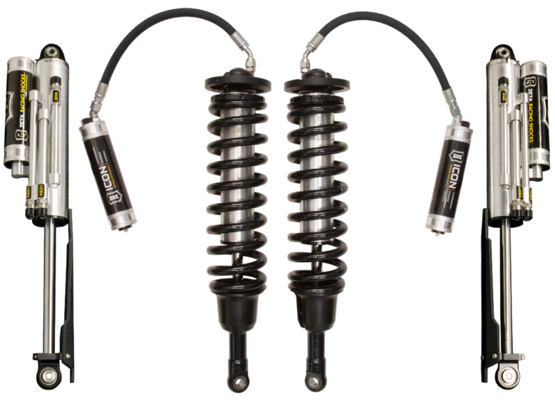 A set of ICON 10-14 Ford Raptor Stage 1 Suspension System shocks with coil springs and reservoirs, showcasing the Icon branding. The image features two pairs of shocks along with their easy-to-adjust knobs, highlighting their design and components against a white background.