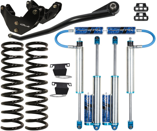 The image showcases a selection of automotive suspension components, such as coil springs, 2.5-inch shocks accented with blue features, a sway bar, and additional items. This detailed arrangement is set against a plain white background, ideal for enthusiasts considering enhancements like the Carli Suspension Pintop System for the 13-23 Ram 3500 (4WD - Leaf) AIR RIDE DIESEL with a 3.25" lift.