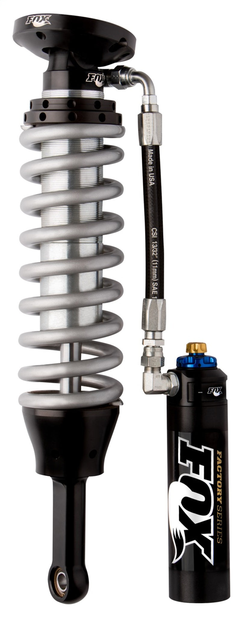 The Fox 05+ Tacoma w/UCA 2.5 Factory Series 4.94in. Remote Reservoir Coilover Shock with DSC Adjustment is equipped with a coiled spring and an attached reservoir, offering enhanced Dual Speed Compression adjustment for exceptional performance. Highlighted in black and zinc, this FOX model is specifically designed for off-road vehicle suspension systems.