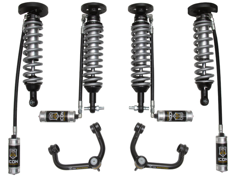 A suspension system for the 2014+ Ford Expedition 4WD, consisting of four components including coil-over shocks and tubular upper control arms equipped with heavy-duty ball joints. The shocks, which feature attached metal coils and reservoirs, prominently display the "ICON" brand name. The Delta Joint technology enhances durability. Set against a white background.