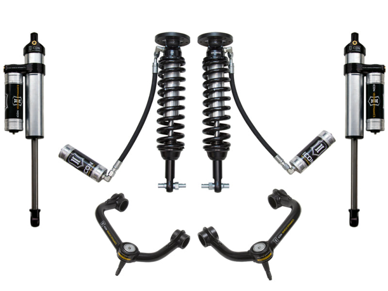 The image showcases the ICON Stage 4 Suspension System for the 2014 Ford F-150 2WD, which includes two coilover shocks with springs, two additional shock absorbers with attached reservoirs, and two A-arms. Designed for corrosion resistance, these components feature a stylish black and silver finish with advanced Delta Joint technology.