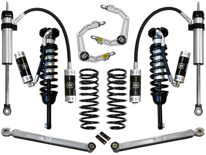 A selection of components from the ICON 03-09 Toyota 4Runner/FJ 0-3.5in Stage 5 Suspension System with Billet UCA, showcasing upper control arms, shock absorbers, coil springs, and Delta Joint technology, arranged symmetrically on a white background.