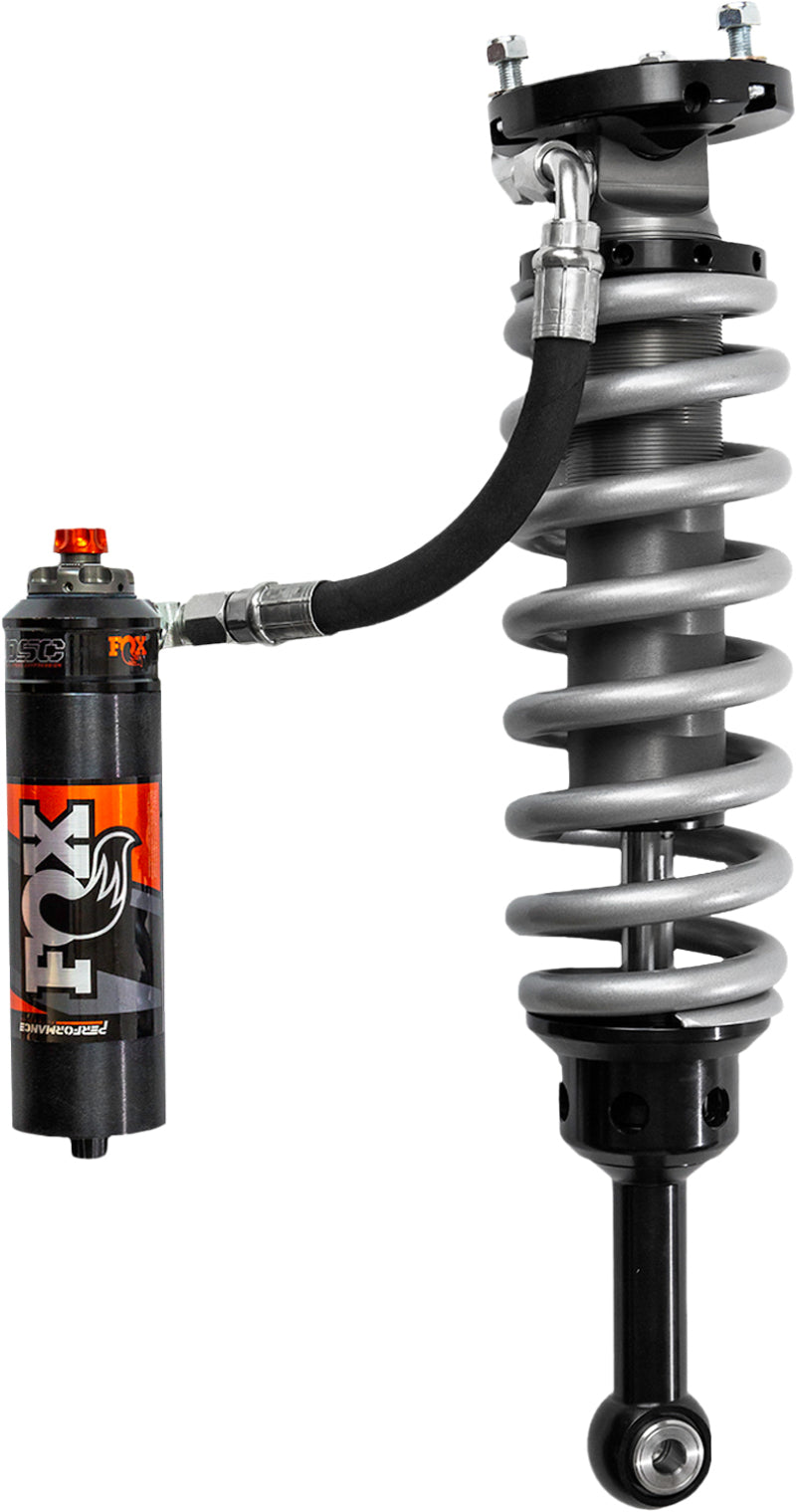 Image of the FOX 2003+ Toyota 4Runner 2-3in Lift Front Performance Elite 2.5 Coilover Reservoir Shocks with DSC adjusters. It showcases a metallic finish and is designed to improve vehicle handling and ride quality, making it ideal for off-road enthusiasts who desire superior suspension articulation.