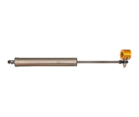 The Carli Suspension 03-08 Dodge RAM 2500/3500 (4WD) Stainless Low-Mount Steering Stabilizer is a horizontal metal component with a cylindrical body and rod, crafted from stainless steel. It includes a small, round, gold-colored attachment on one end, specifically designed for use with Dodge Ram 2500/3500 models.