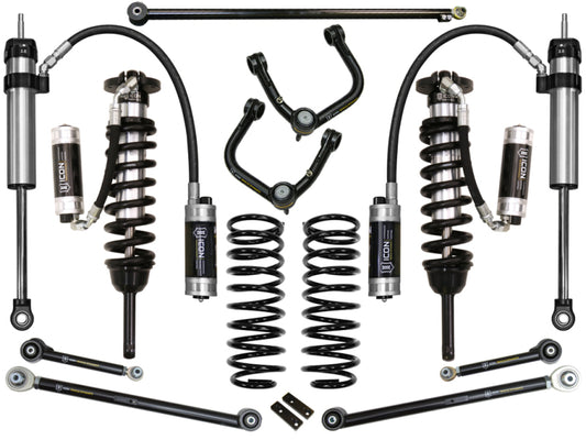 The ICON 2010+ Toyota FJ/4Runner 0-3.5in Stage 7 Suspension System with Tubular Uca, known for its robust design and advanced Delta Joint technology, features upper control arms with heavy-duty ball joints. These components are arranged symmetrically against a white background, predominantly in black with some metallic elements.