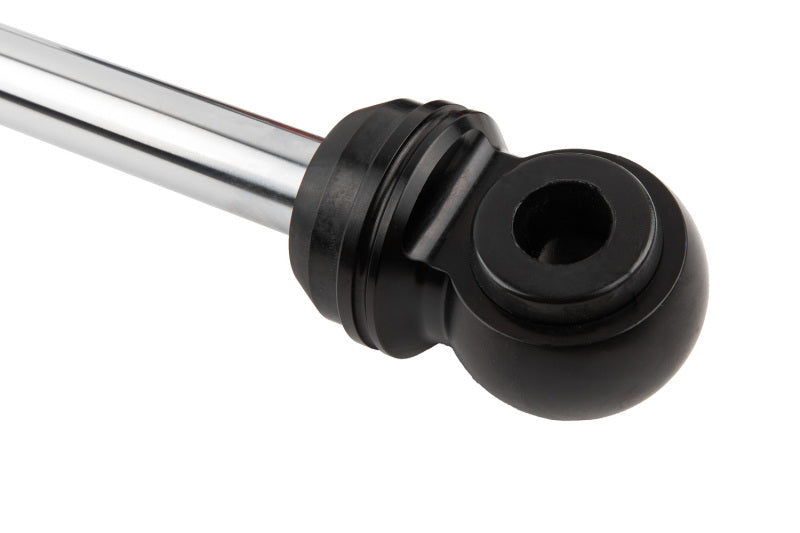 A close-up of a black spherical rod end with a silver metal shaft, reminiscent of the precision found in the Fox 2019+ GM 1500 Performance Elite Series 2.5 Reservoir Rear Adjustable Shocks by FOX, against a white background.