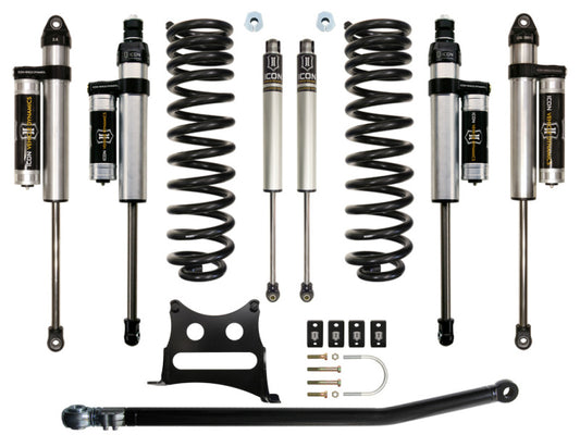 The ICON 05-16 Ford F-250/F-350 2.5in Stage 4 Suspension System includes six ICON shock absorbers, two coil springs, a track bar, brackets, and bolts, all neatly arranged on a white background.